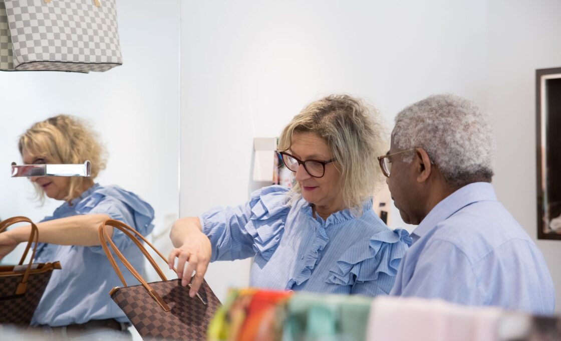 Woman examining a designer handbag