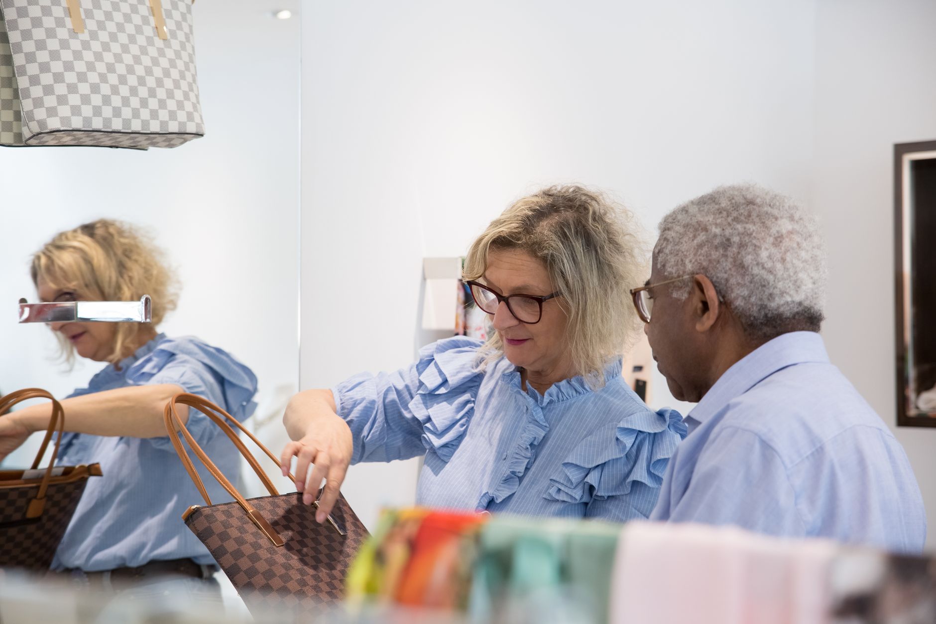 Woman examining a designer handbag