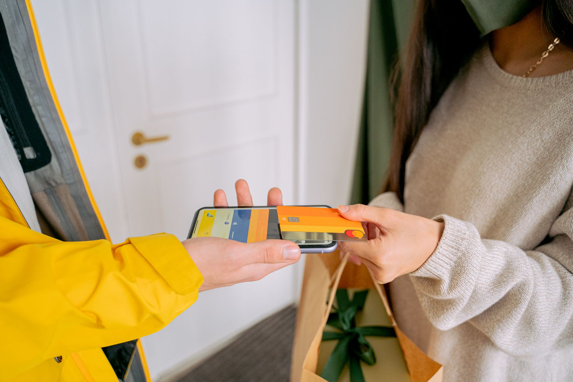 Woman shopping online for gifts with a phone during the holidays