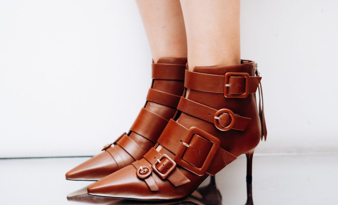 A pair of leather ankle boots styled for fall