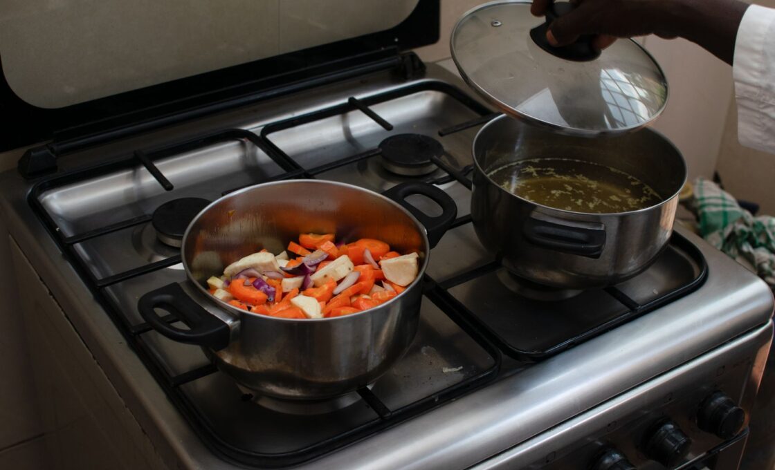 A pot of hearty soup simmering on a stovetop