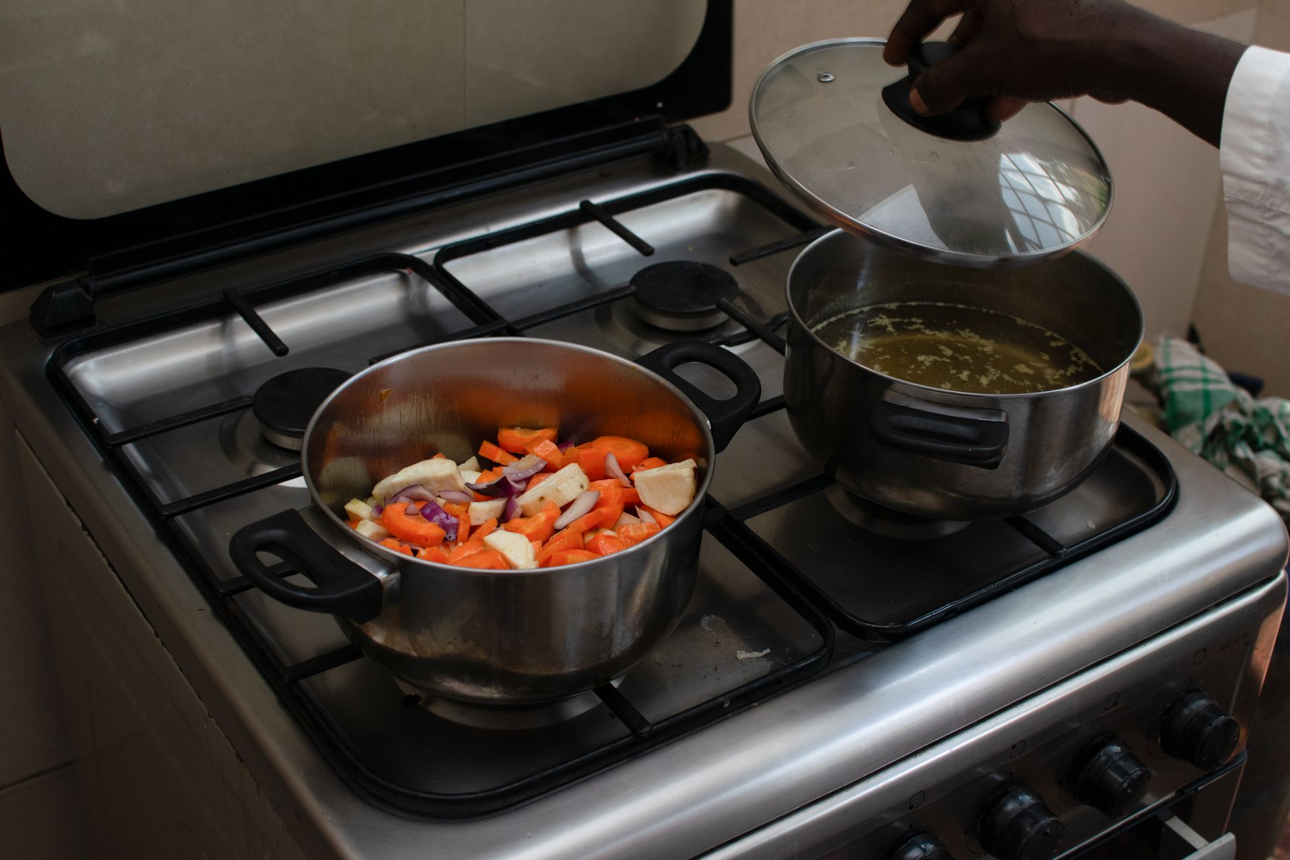 A pot of hearty soup simmering on a stovetop