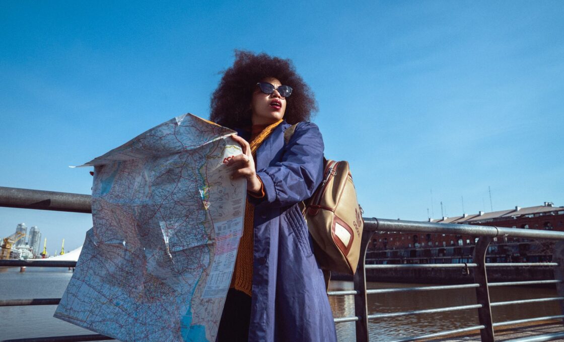 A woman traveling solo with a backpack exploring a city