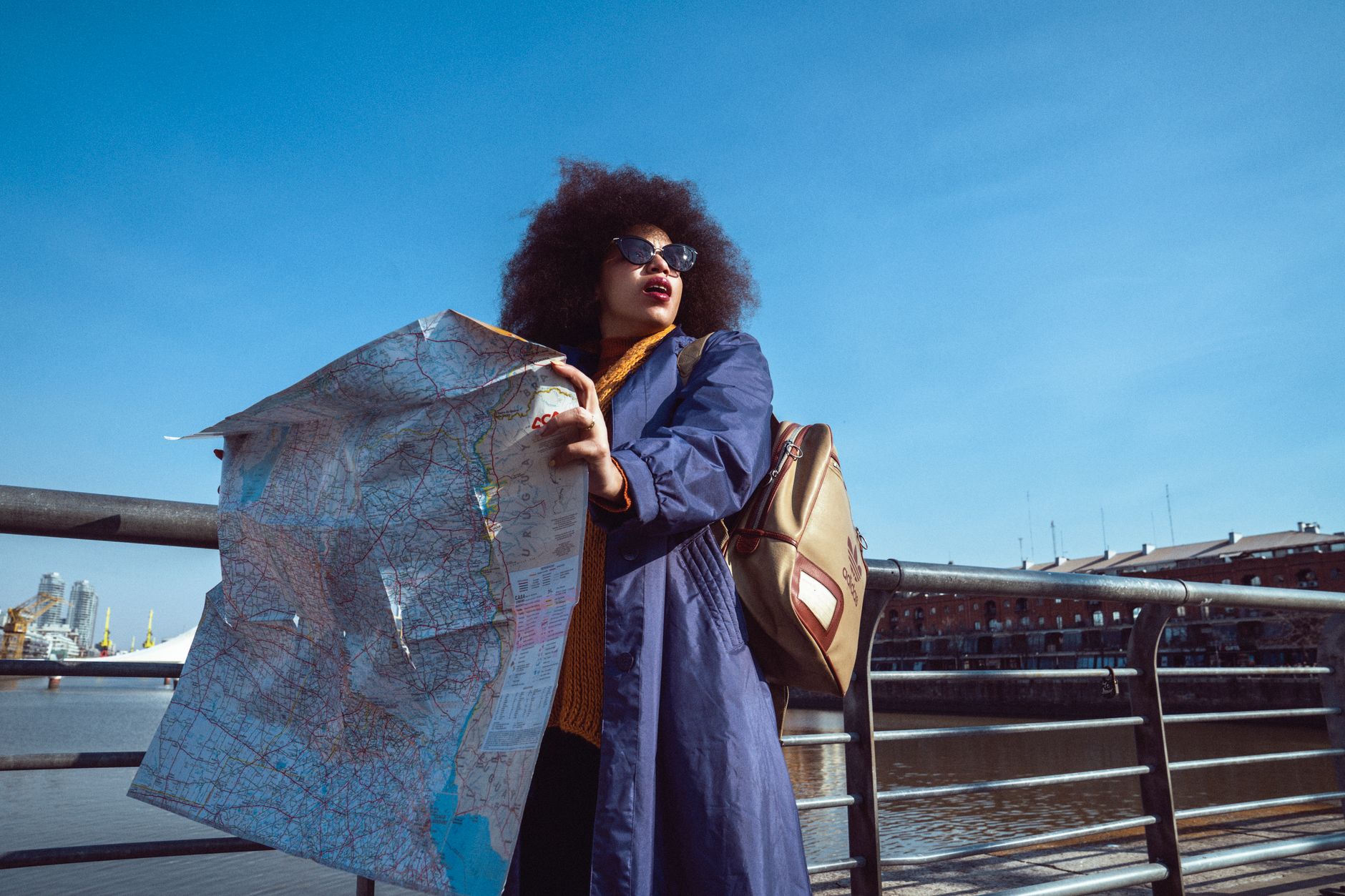 A woman traveling solo with a backpack exploring a city