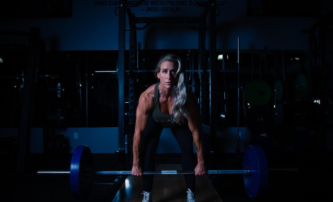 Woman lifting dumbbells during a strength training session
