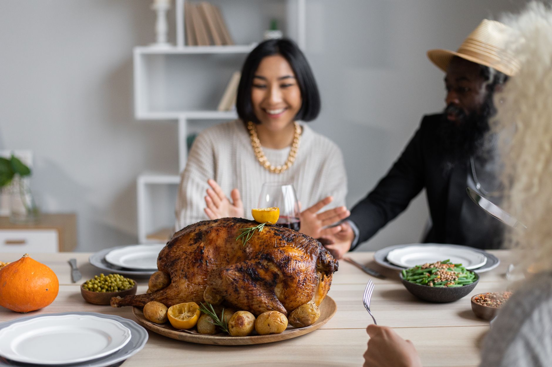Roast Thanksgiving turkey on a family dinner table, illustrating the fresh vs frozen turkey decision