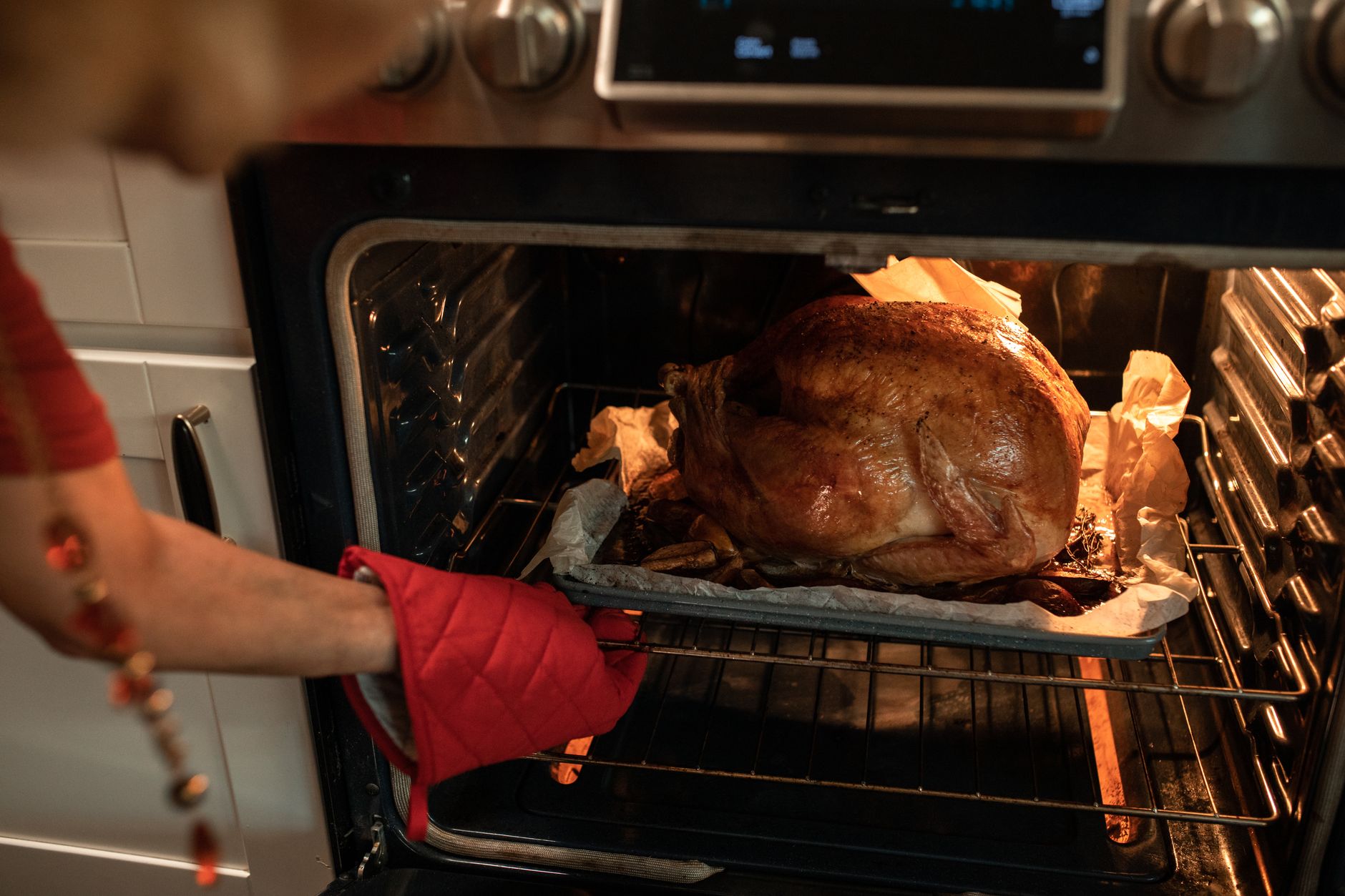 Roasted Thanksgiving turkey coming out of the oven, when the two-hour leftovers clock starts