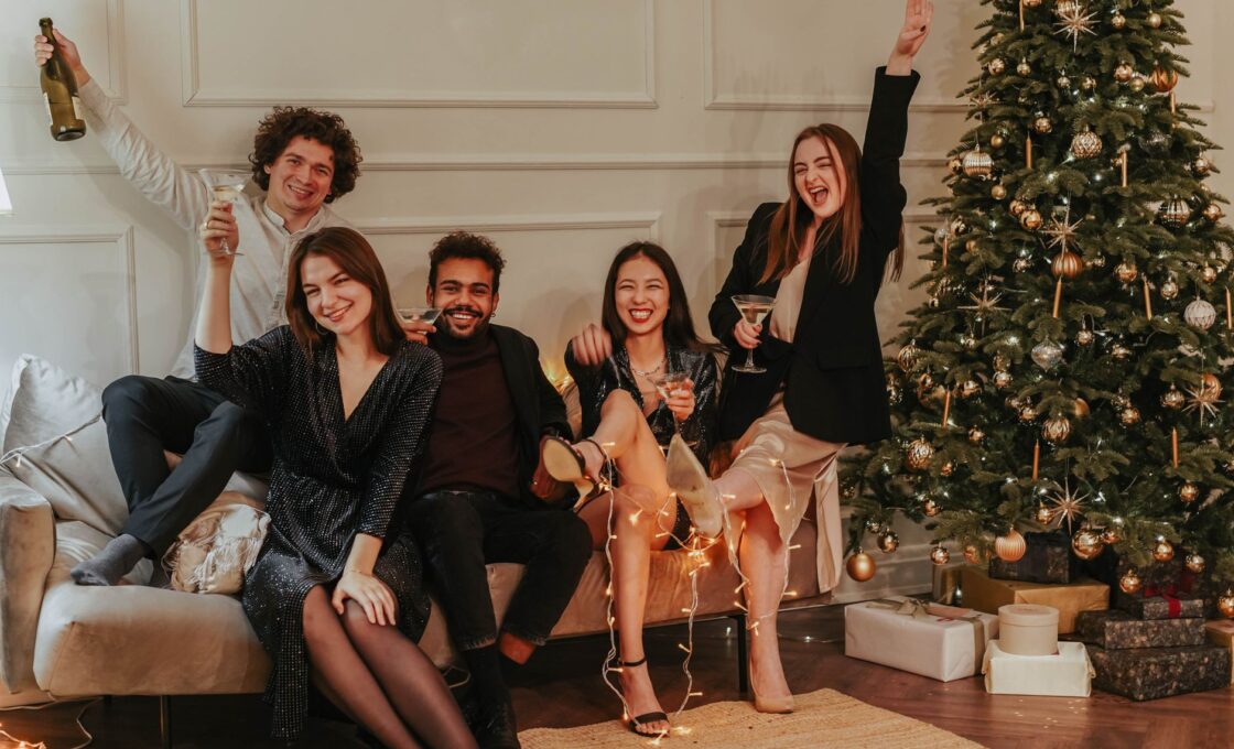 Women dressed up for a holiday party in festive dresses