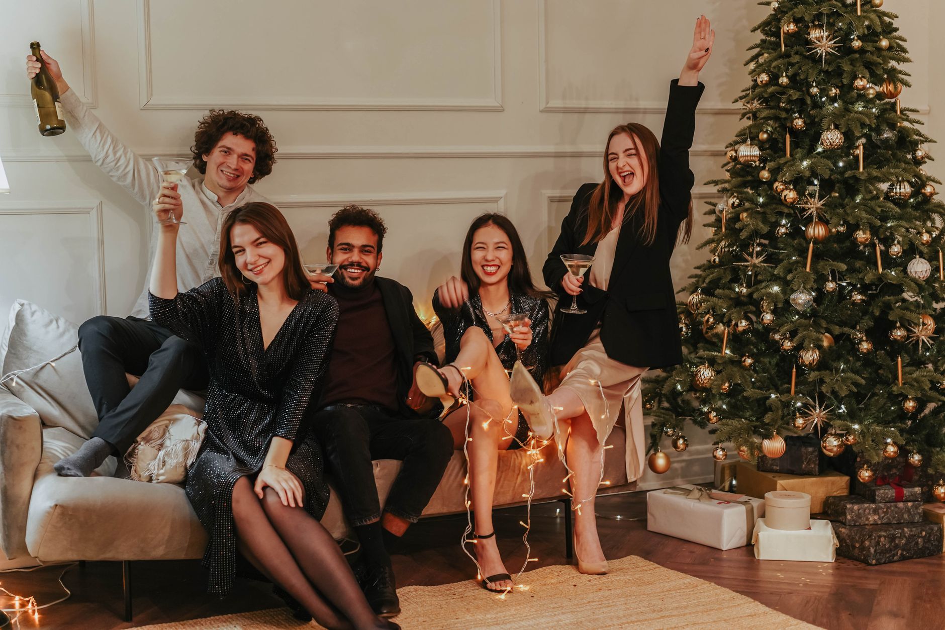 Women dressed up for a holiday party in festive dresses